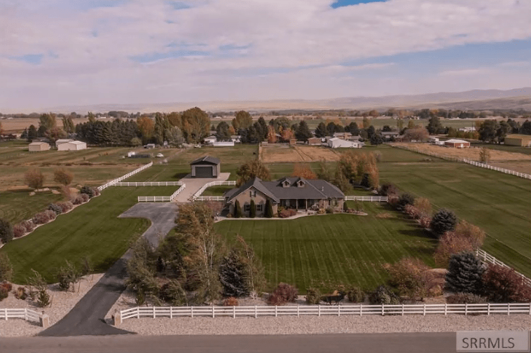 Top view of land with a grassy area under a clear sky