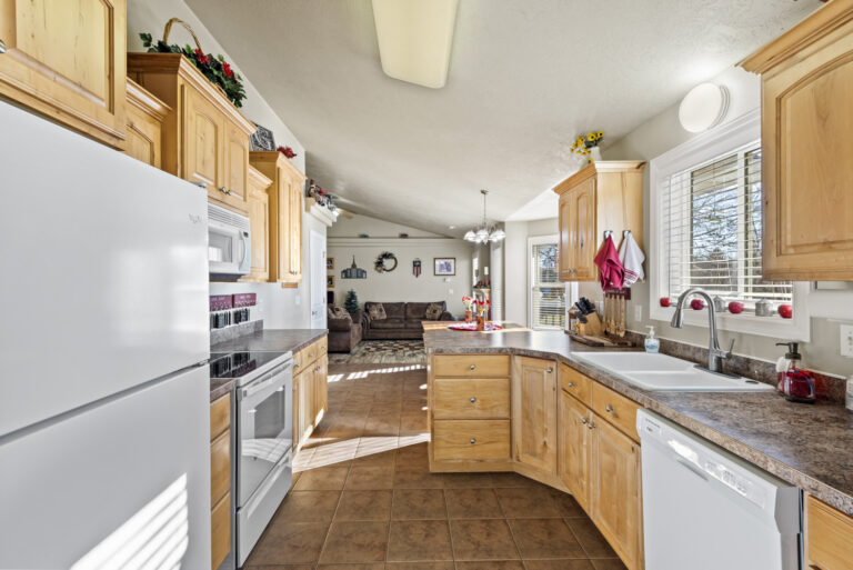 A kitchen room, showing various appliances and cabinets