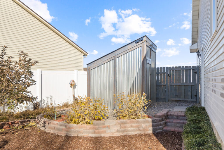 A home with a small room and an open area with trees