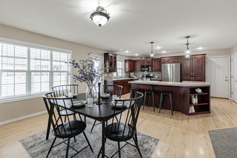 Modern kitchen interior with dining area, natural light